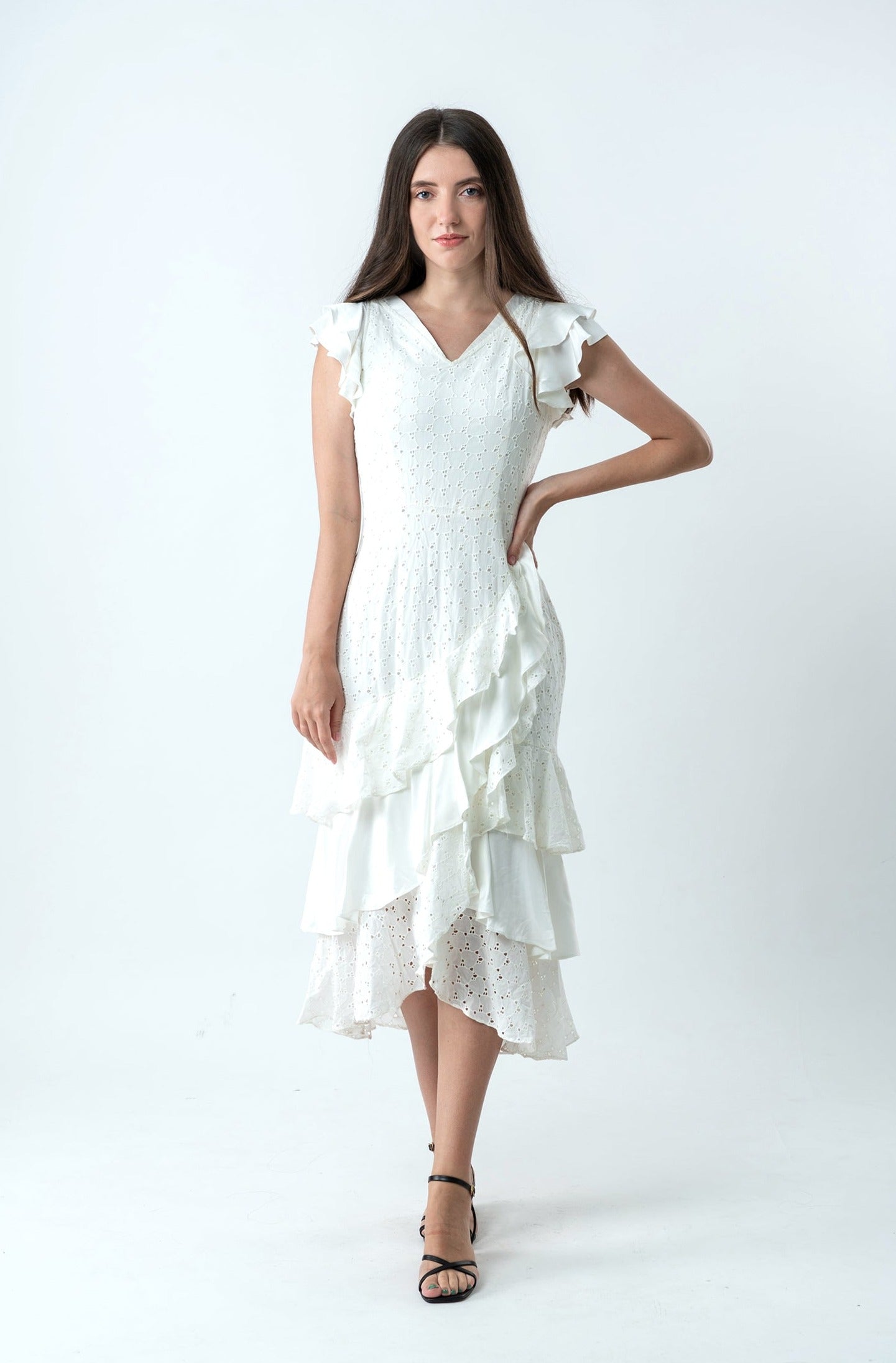 The cotton white dress has us dreaming of summer strolls through the romance capitals of the world.