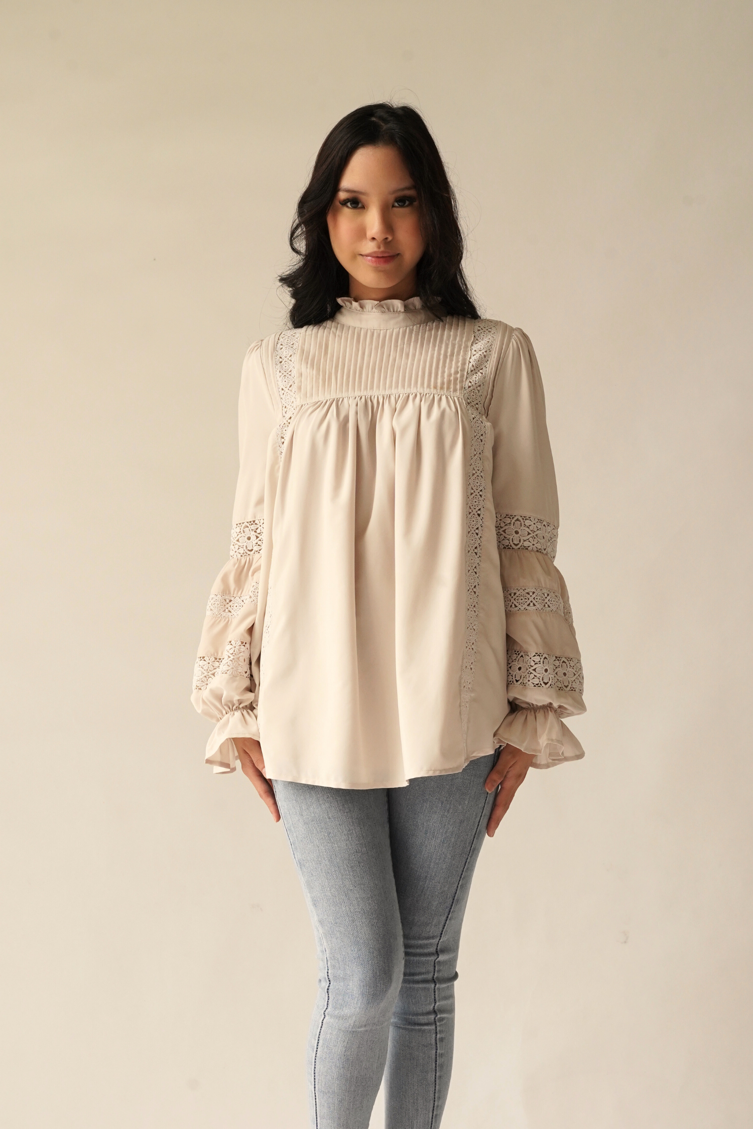 Paying homage to our Solange Kurung which made a debut this Eid - the Sonya Top is rendered in 100% soft, ultra lightweight matte polyester that features intricate pin-tucks at the bodice, floral inset lace detailing streaming down the bodice and at the puffed, bracelet-length sleeves.