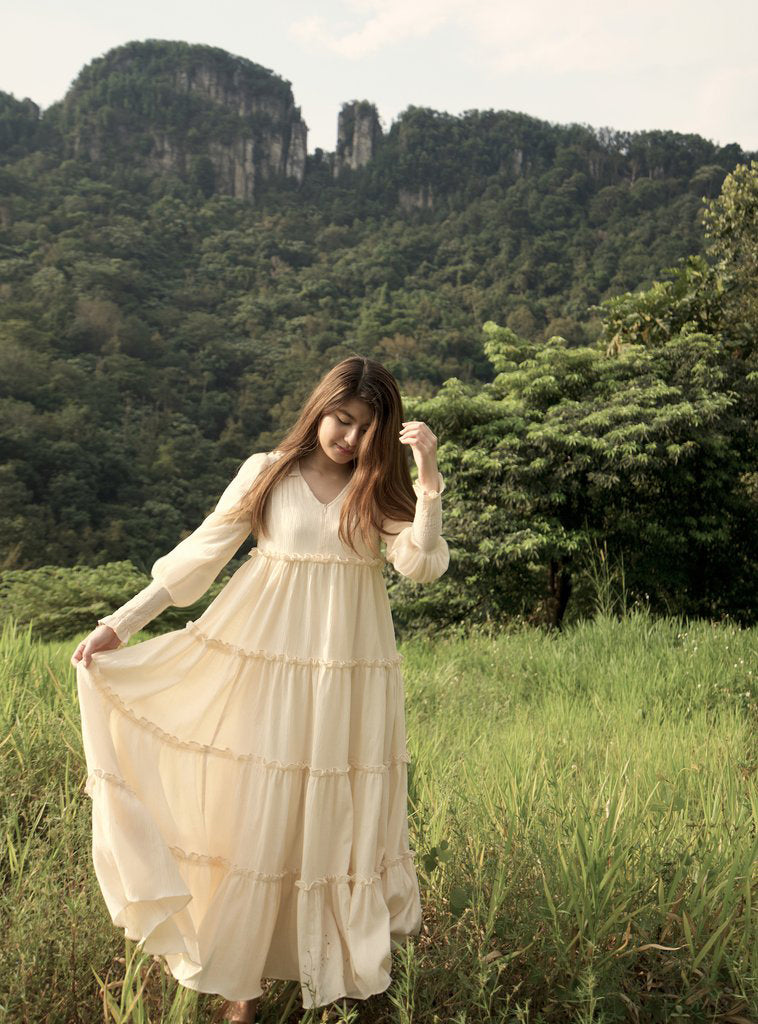 The Charles dress is a cloud-like fantasy - with shirring and ruffles detailing at both sides of the shoulder yoke, and a romantic touch of puffed sleeves and shirred cuffs add character to the playful flare to the loose, comfortable fit of the dress with ruffles begin below the bust to flatter all body shapes.