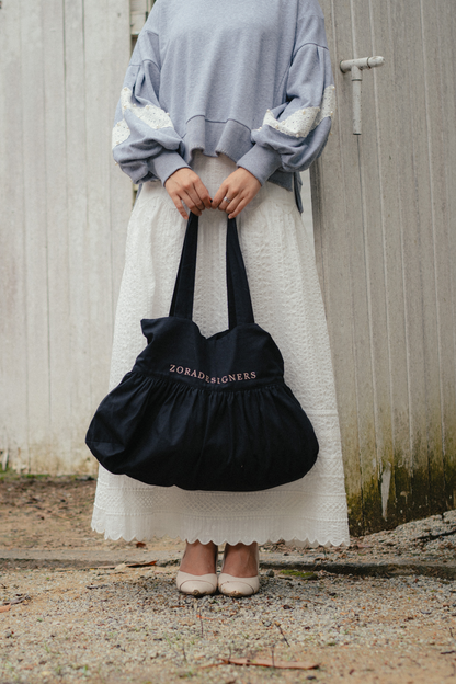 THE SIGNATURE DRESS BAG IN BLACK