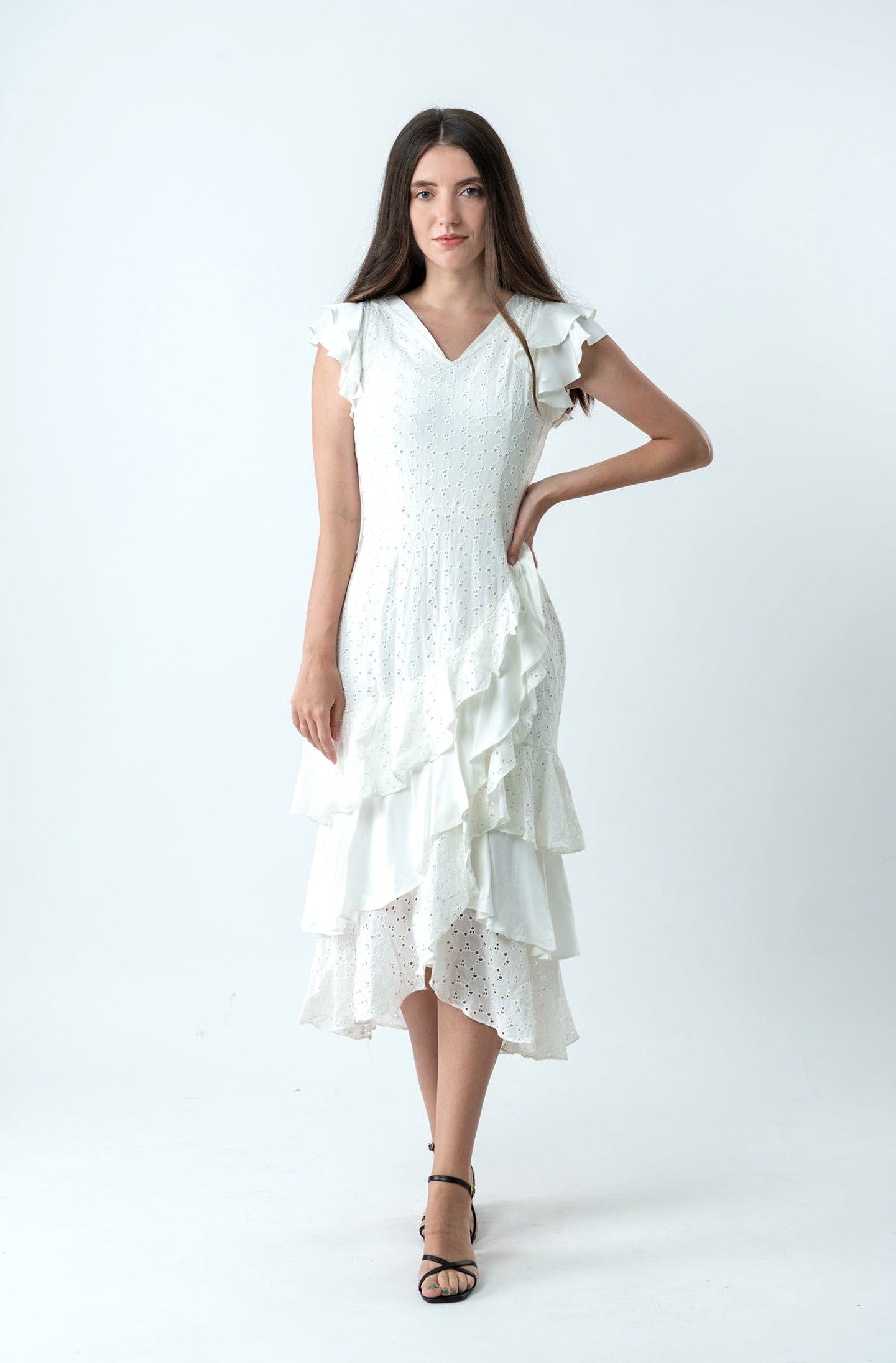 The cotton white dress has us dreaming of summer strolls through  the romance capitals of the world.