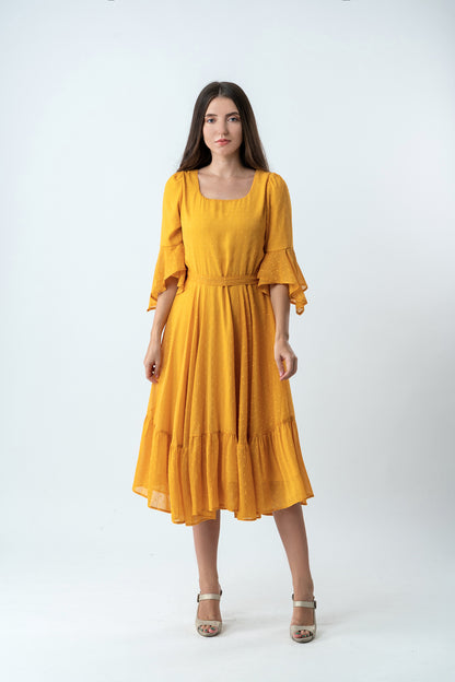A great square-neck style is hard to come by but the Karly dress proves us wrong. It's cut from smooth silk in mustard yellow, and features an artful circular flounce sleeve and flounce hem skirt.
