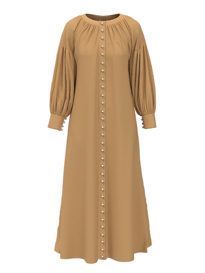 The Nour dress is an ode to the sandy dunes of the Arabian desert represented by the textured beige material and a reminiscent of our classic Eid ’22 Opal Kurung in beige.