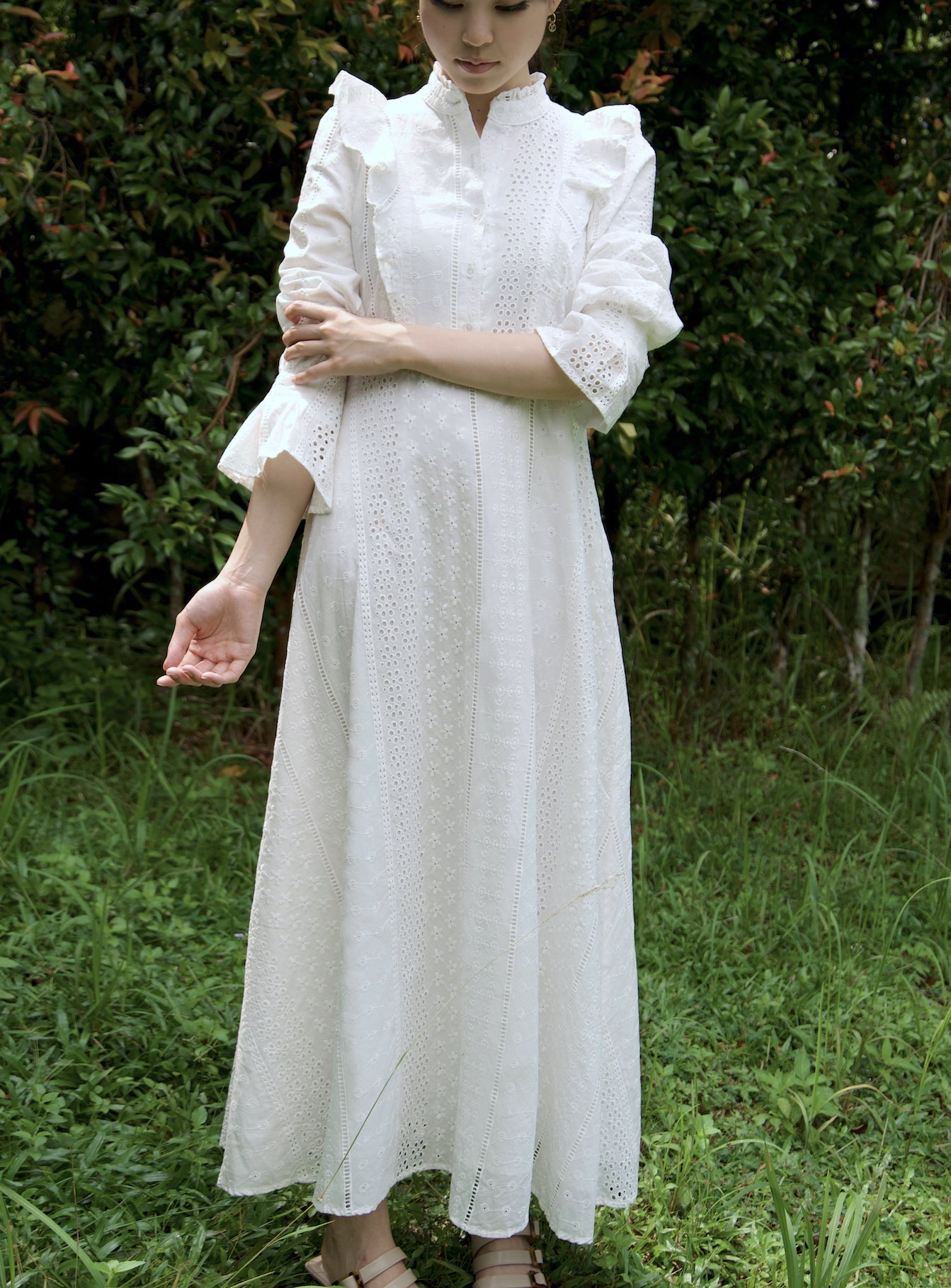 In 100% premium organic cotton, our ZORA Pearl dress is our love letter to broderie anglaise, with a bias cut to illuminate the beauty of its intricate floral detailing. This dress combines some of our favourite features - high ruffle-trimmed collar, button down ruffled bodice, puffed sleeves leading down to a perfect flutter sleeves at wrist length, and floral embroidery detailing at random. 